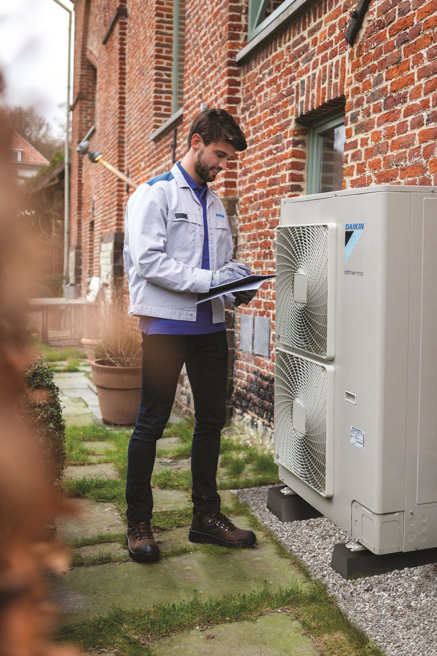 Man installing outdoor unit